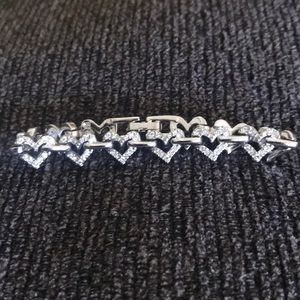 Silver toned and crystal hearts bracelet